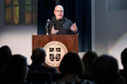 Fr. Michael Patella presenting to a crowd at St. Edward's University in October 2019.