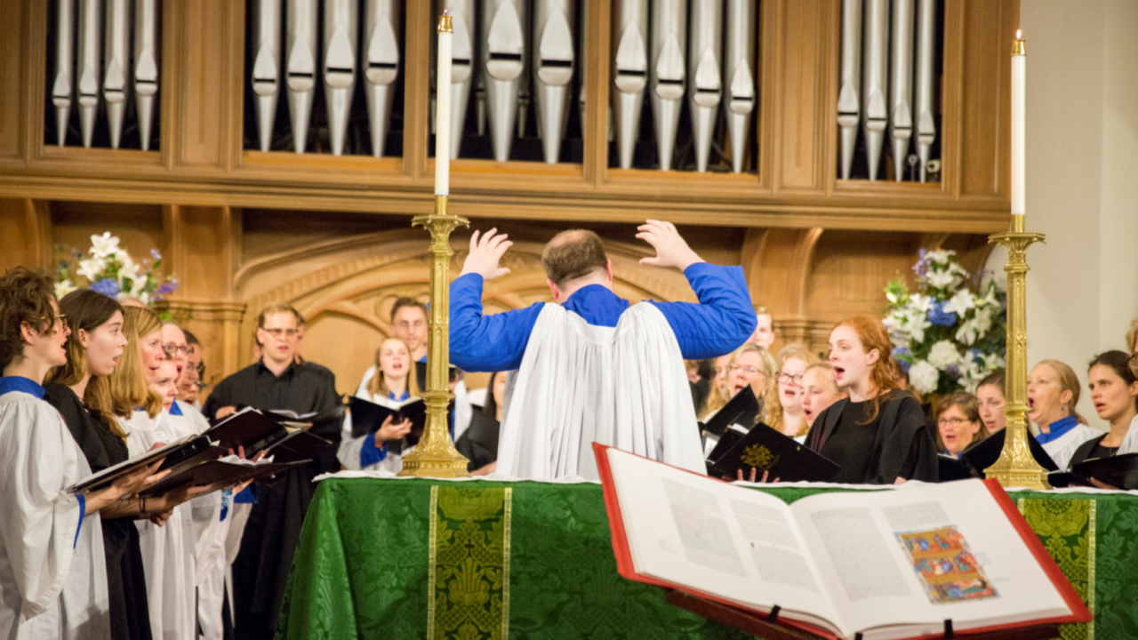 Choir performance around The Saint John's Bible at St. Luke's Parish