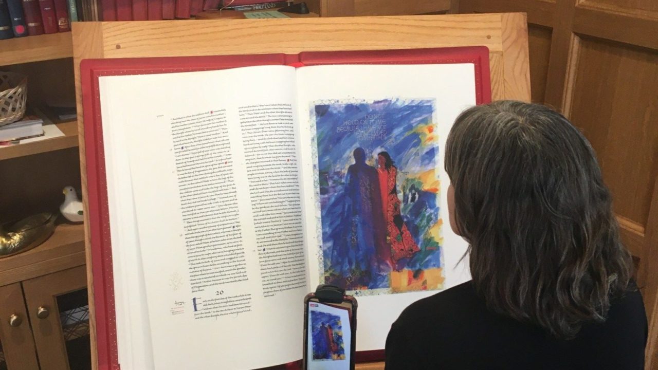Diana Bender livestreaming a reading from the Heritage Edition