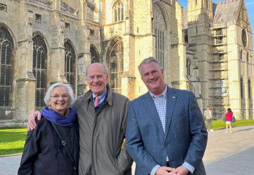 From left to right - Mabel Jackson, Donald Jackson, and Reverend John Ross stand before the Canterbury Cathedral.