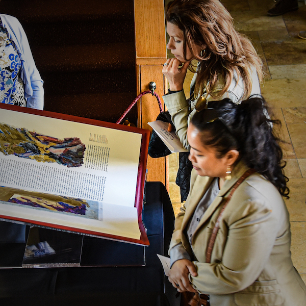 Worshipers observe a Heritage Edition of The Saint John's Bible