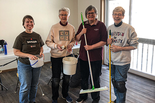 Sister Karen volunteers for Habitat for Humanity with three other sisters