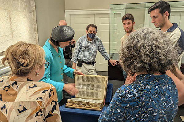 Sotheby’s Senior Consultant and Judaica Expert Sharon Mintz shows visitors the Codex Sassoon
