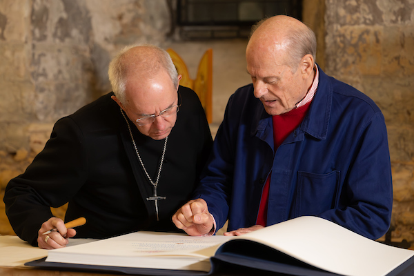 Photo by Neil Turner: The Archbishop of Canterbury Justin Welby (left) signs Lambeth Palace Library’s Apostles Edition of The Saint John’s Bible with Creative Director of The Saint John’s Bible Donald Jackson. 