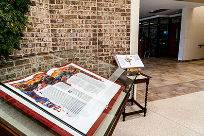 Photo: The Children’s Bible sits beside one Heritage Edition volume in Transfiguration’s Gathering Space. 