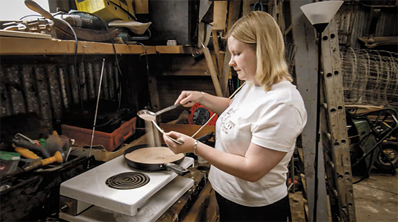 Sarah Harris-Richards, Studio Manager for The Saint John’s Bible project, pours hot sand into the hollow shaft of a feather (5:43).