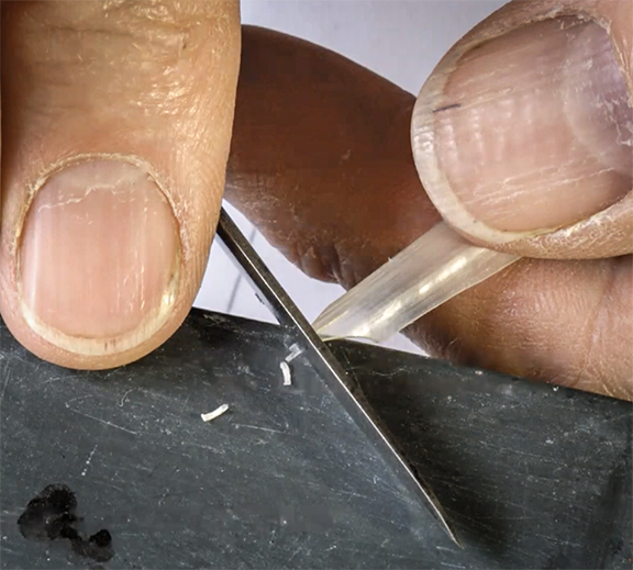 Nibbing is the process of cutting the tip off with a straight cut downward (9:18).