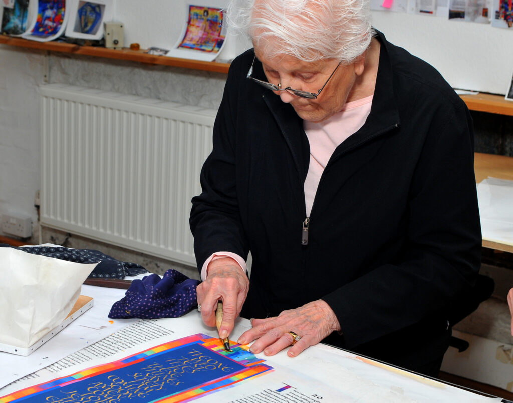 Jo White in the Scriptorium Studio in Wales, burnishing a gold detail on the final “Amen” page of The Saint John’s Bible at the time of its official completion and handover in 2013.