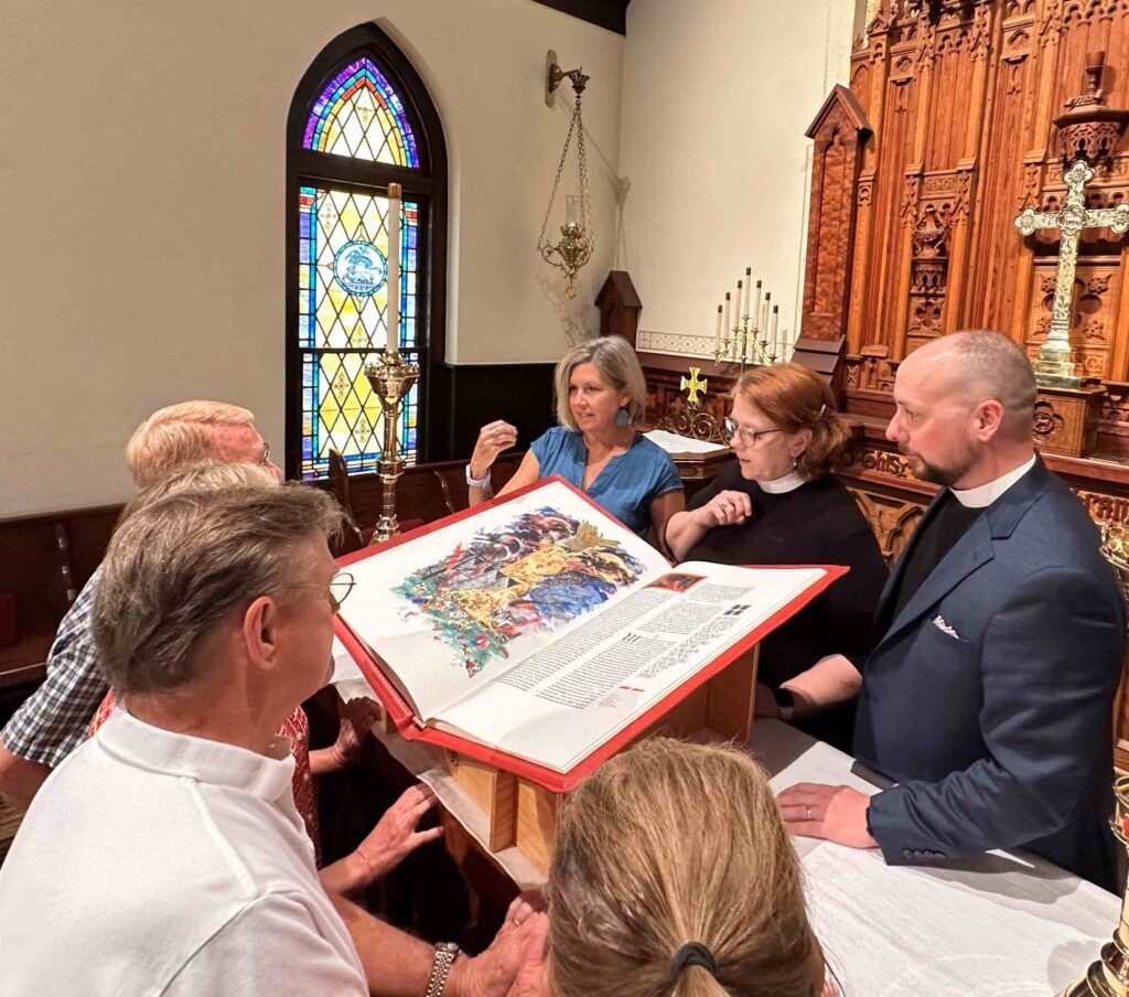 St. John’s Episcopal Church clergy, staff and parishioners, including The Rev. Lonnie Lacy and The Rev. Leslie Roraback, reading from The Saint John’s Bible Heritage Edition Gospels & Acts volume to kickstart their “Year of the Bible.”