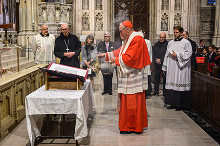 His Eminence Timothy Cardinal Dolan blesses St. Patrick’s Cathedral’s newly gifted Apostles Edition of The Saint John’s Bible. 