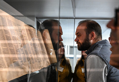 Representatives from St. Olaf College gaze upon ancient texts at the Hill Museum and Manuscript Library at Saint John’s University as part of their ‘Deep Dive’ experience to pick up the College’s Heritage Edition of The Saint John’s Bible.