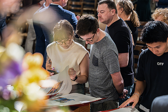 Members of the Duke University community experience the Heritage Edition of The Saint John’s Bible at an evening celebration service. 