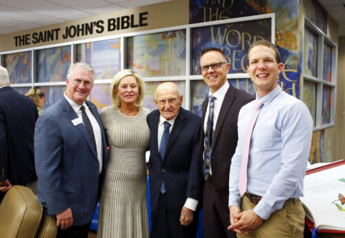 (From left to right) Executive Director of the Heritage Program Rev. Dr. John F. Ross, benefactors Kathryn Ramstad and Paul Christen, President Kittle of Dakota Wesleyan University, and Rev. Richard Anthony Purcell, PhD, Campus Pastor, stand in the new The Saint John’s Bible exhibit at the University.