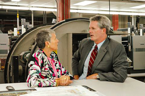 Linda Lovas Hoeschler (left) with Vice President of Institutional Advancement at Saint John’s University Rob Culligan (right) at John Roberts Printing, discussing proof pages of The Saint John’s Bible Heritage Edition. 