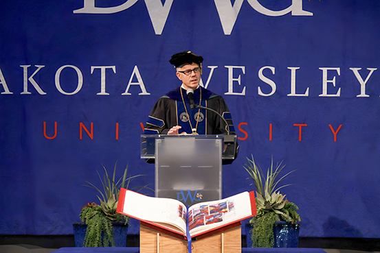 President Kittle of Dakota Wesleyan University speaks at a special worship ceremony to commemorate the welcoming of the Heritage Edition to the University. 